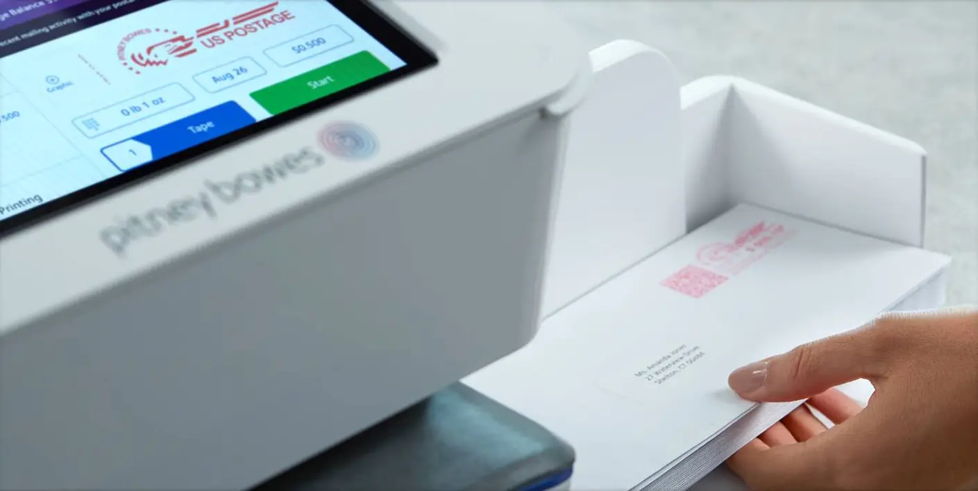 A close up of an electronic device on top of papers.