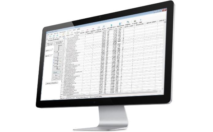 A computer monitor with an excel spreadsheet on it.